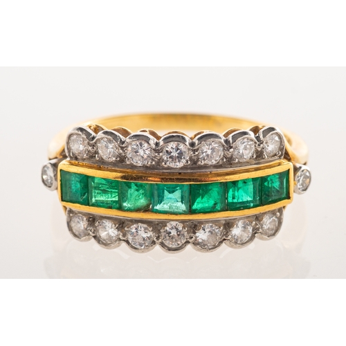 550 - A 1980's 18ct gold emerald and diamond ring, a three row ring, the centre channel set with square-cu... 