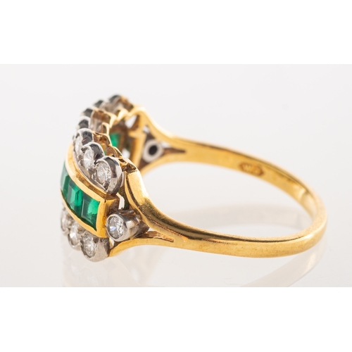 550 - A 1980's 18ct gold emerald and diamond ring, a three row ring, the centre channel set with square-cu... 