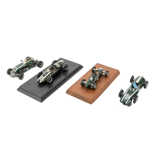 636 - A group of seven built white metal Cooper racing cars, five mounted on display plinths, various make... 