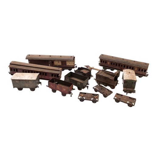 671 - A collection of tin plate gauge 1 passenger coaches and wagons. Comprising three LMS passenger coach... 