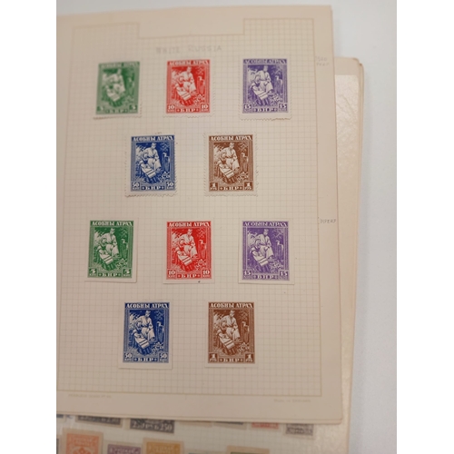 100 - Russia. A collection of Russian stamps on album pages, with interest in early covers including Zeppe... 