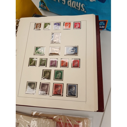 101 - World. An accumulation of stamps in four bags-for-life including, useful Austria in one country albu... 