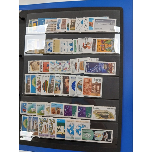 104 - Great Britain and World. A collection of stamps in seven volumes, including Great Britain with early... 