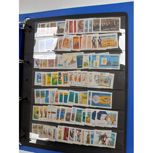 104 - Great Britain and World. A collection of stamps in seven volumes, including Great Britain with early... 