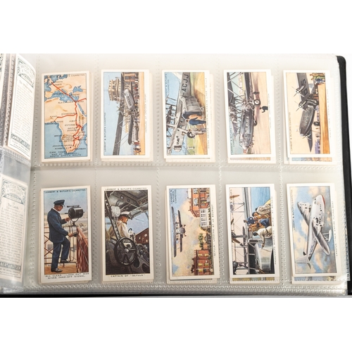 11 - Ogden's Cigarette Cards. An album of sets and part sets including 'Photos of General Interest', and ... 