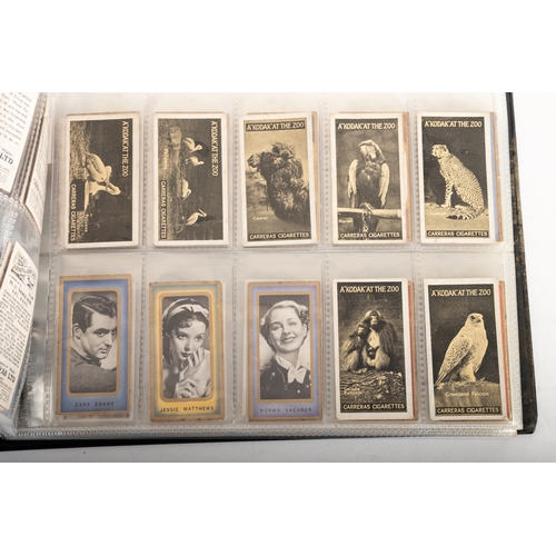 11 - Ogden's Cigarette Cards. An album of sets and part sets including 'Photos of General Interest', and ... 