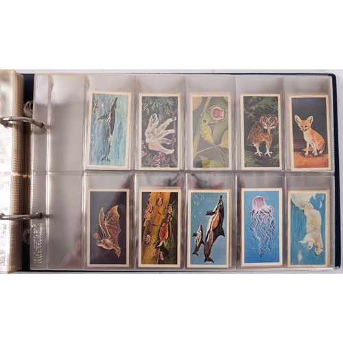 17 - Ty-phoo and others. Four albums of various trade cards, various subject matter and publishers.