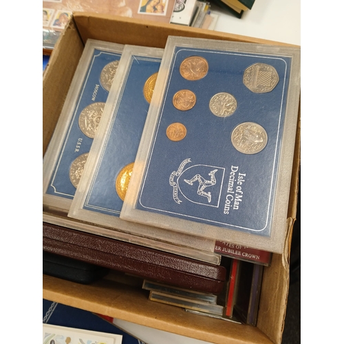 86 - Stamps and Coins. A collection of GB presentation packs, world coins, cased modern crowns, thematic ... 