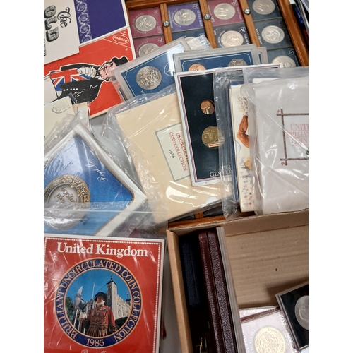 86 - Stamps and Coins. A collection of GB presentation packs, world coins, cased modern crowns, thematic ... 