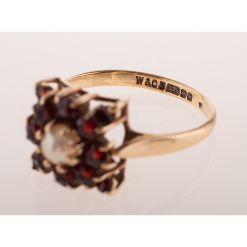 827 - A vintage 9ct gold garnet and pearl cluster, of square form, claw set to the centre with a cultured ... 