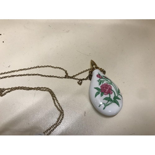 146 - Porcelain Scent bottle with screw top on chain