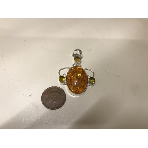 134 - 925 Silver & pressed Amber pendant
