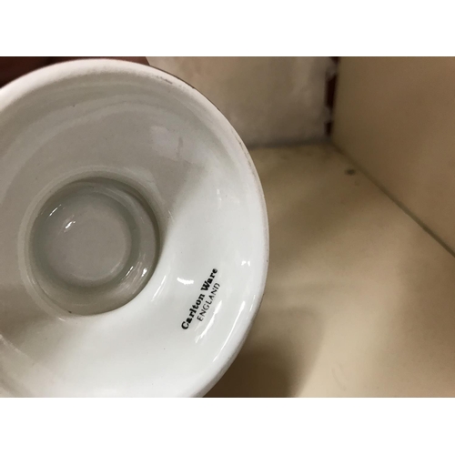 141 - Pair of small Carlton ware candle holders