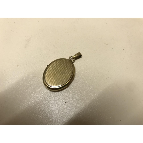 128 - Rolled gold locket