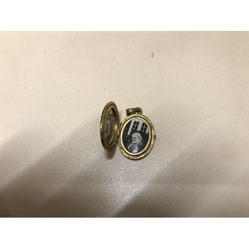 128 - Rolled gold locket