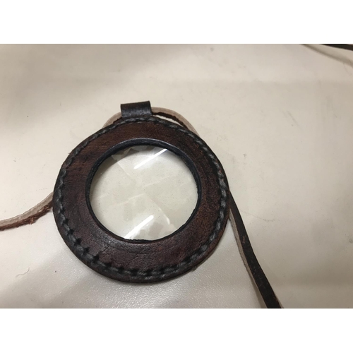 127 - Magnifying glass in leather surround on leather lanyard