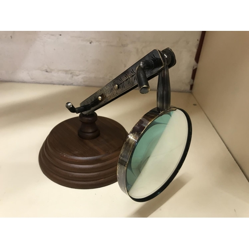 289 - Folding magnifying glass on wooden base, 4