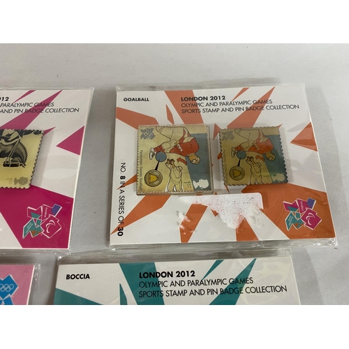 154 - 4 x Packs of London Olympics 2012 Sports Stamps & Pin Badge Collection