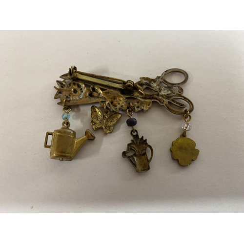 136 - Vintage 'Gardeners' Brass Brooch