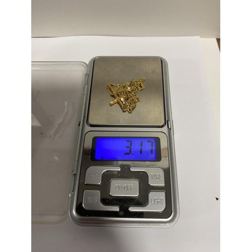 13 - 9ct Gold Cross on 18