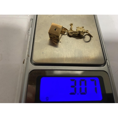 31 - 2 x 9ct Gold Charms - Dice & Scooter, weight 3.07g