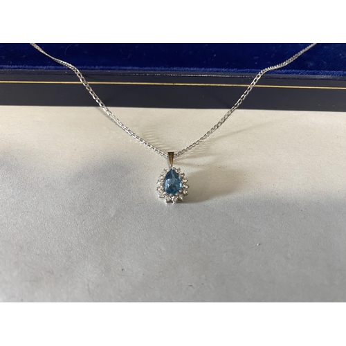 105 - 9ct Gold Topaz Pendant on 9ct White Gold Chain