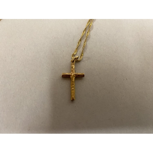 22 - 9ct Gold Cross on 9ct 18