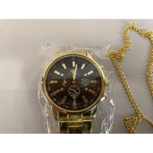 20 - Gents Gold Tone Watch, Cross Necklace & Bracelet Set (Watch needs Batteries & Small Dials are Decora... 