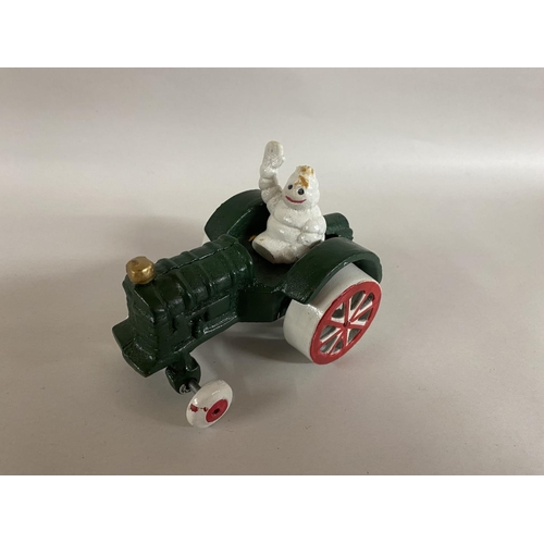 241 - Cast Metal Michelin Man in Tractor, 4