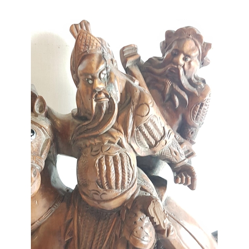 5 - Oriental carved hardwood figure of a horse carrying 2 men. Approx. 21