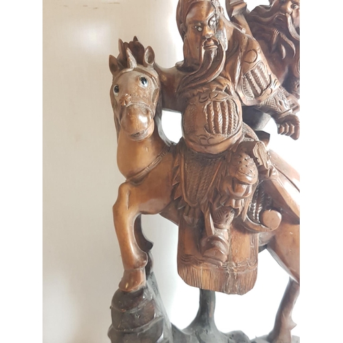 5 - Oriental carved hardwood figure of a horse carrying 2 men. Approx. 21