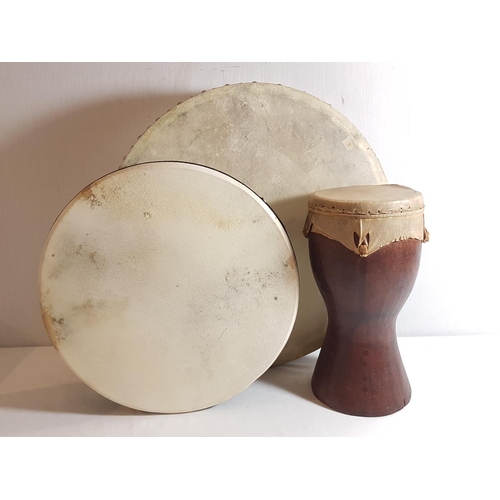 18 - 3 Hand held drums and a small bongo drum