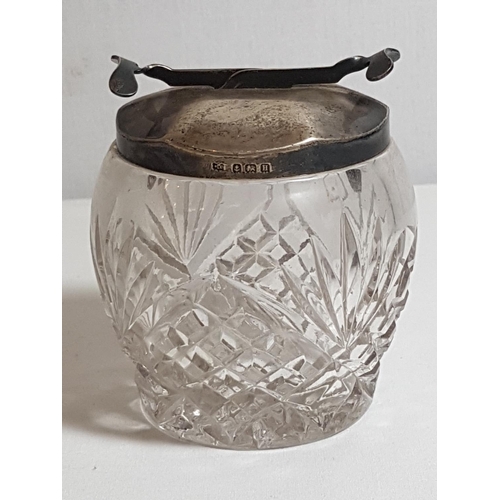 44 - Cut glass sugar bowl with HM silver sugar tong lid. Approx 3.5