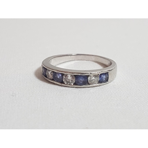 179 - Platinum set Tanzanite and diamond half hoop ring