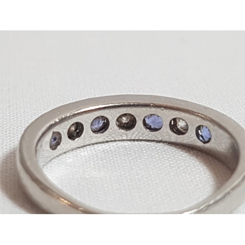 179 - Platinum set Tanzanite and diamond half hoop ring