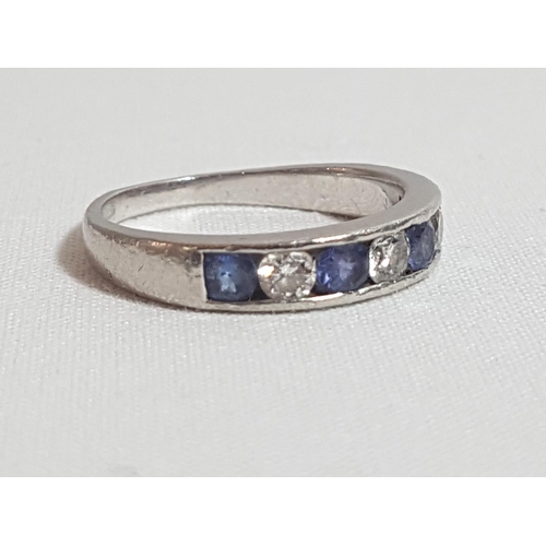 179 - Platinum set Tanzanite and diamond half hoop ring