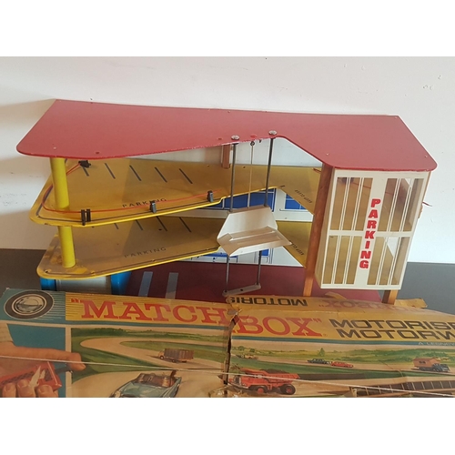 329 - Boxed Matchbox motorway plus a boxed car garage