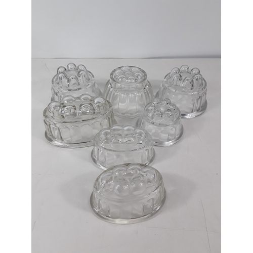 110 - 7 vintage glass jelly moulds