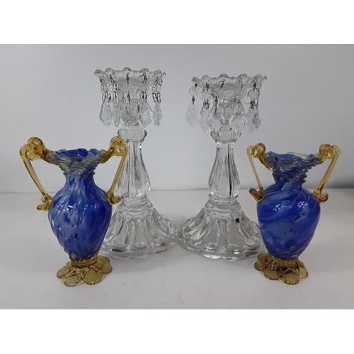 140 - Pair of blue glass vases and pair of candlesticks