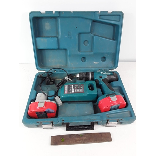 197 - Cased Makita drill and spirit level