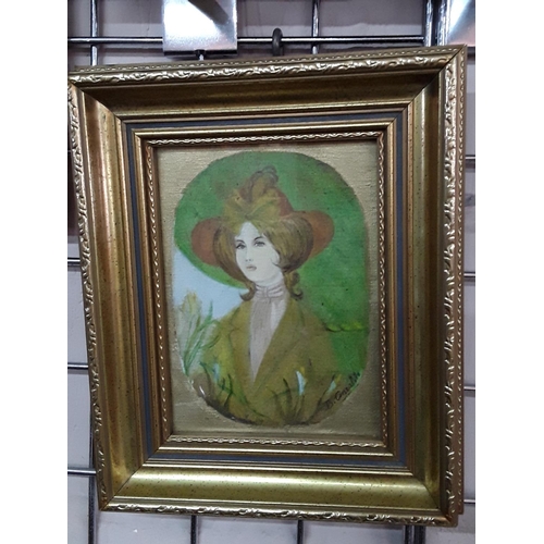 291 - Signed gilt framed oil of a lady