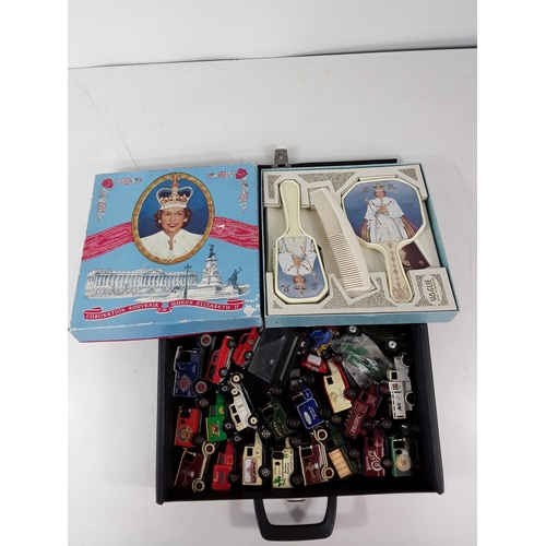 319 - Coronation souvenir brush and comb set and box of model vehicles