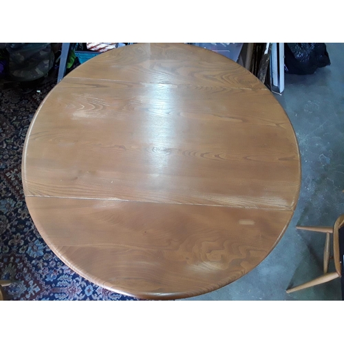 368 - Ercol mid century round drop leaf dining table