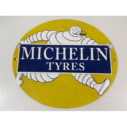 39 - Cast metal Mitchelin tyre sign approx 26cms by 30cms