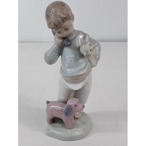 654 - Nao figure of a boy with dog and teddy