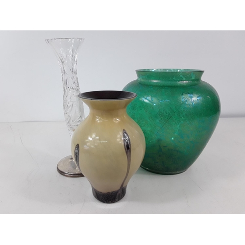 662 - 2 art glass vases and a vase with a silver base