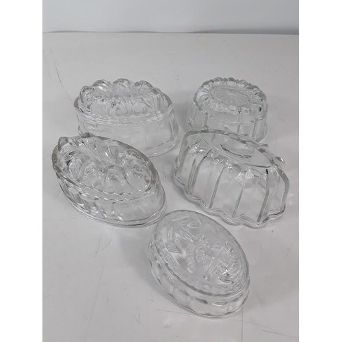 83 - 5 glass jelly moulds