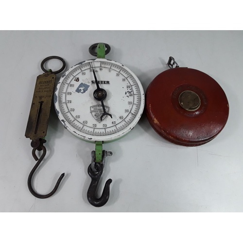 293 - 2 spring balance scales and a leather tape