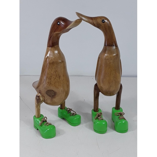 27 - 2 small carved wood ducks each approx 10inches tall