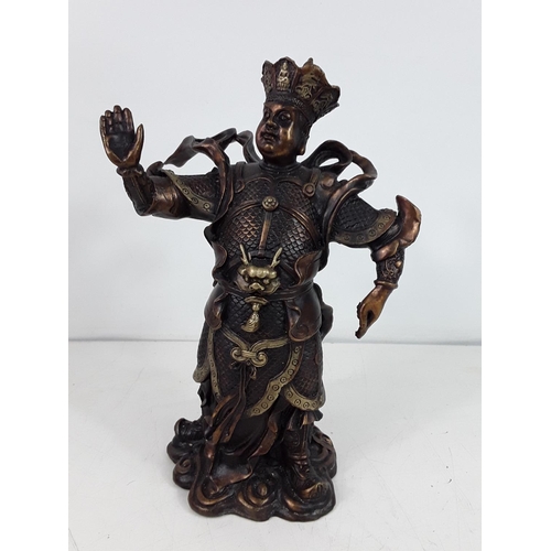 30 - Cast bronze oriental god figure approx 10 inches tall